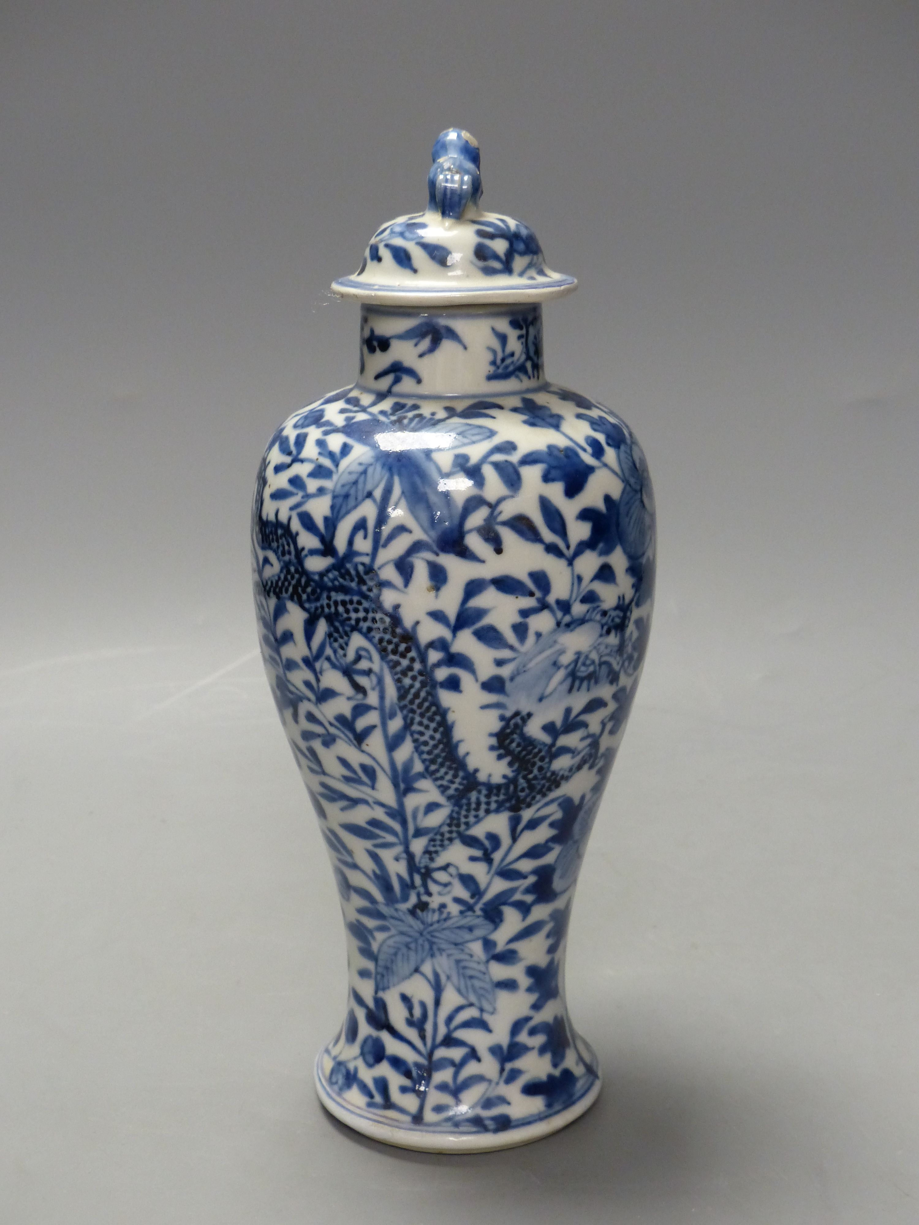 A 19th century Chinese blue and white dragon vase and cover, height 27cm